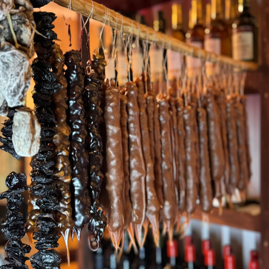 Churchkhela and wine shelves at Cultura